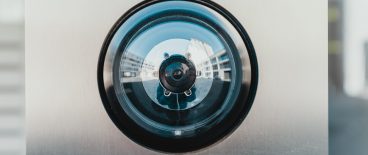 Closeup image of an outdoor doorbell camera lens