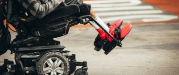 person sitting in electric wheelchair