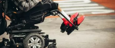 person sitting in electric wheelchair