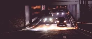 multiple cars traveling on dark highway at night