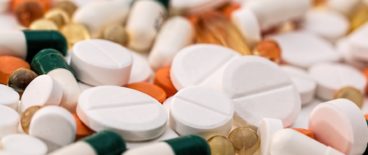 pile of different colored and shaped pills