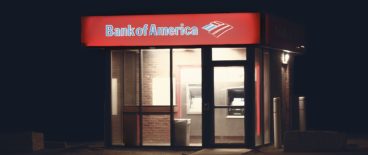 bank building at night with lights on