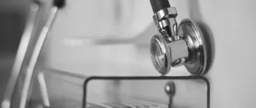 close up of stethoscope hanging on wall